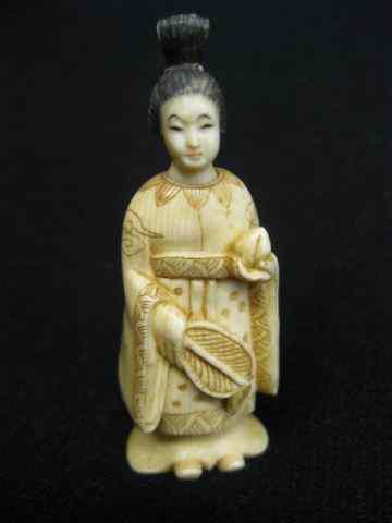 Appraisal: Carved Ivory Figurine of a Lady with fan polychrome trim