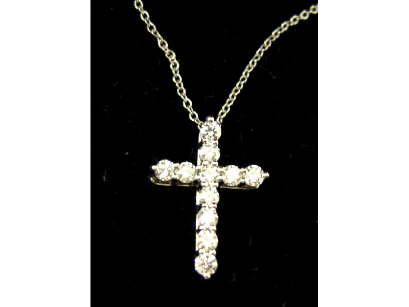 Appraisal: TIFFANY DIAMOND CROSS Platinum cross pendant set with eleven round