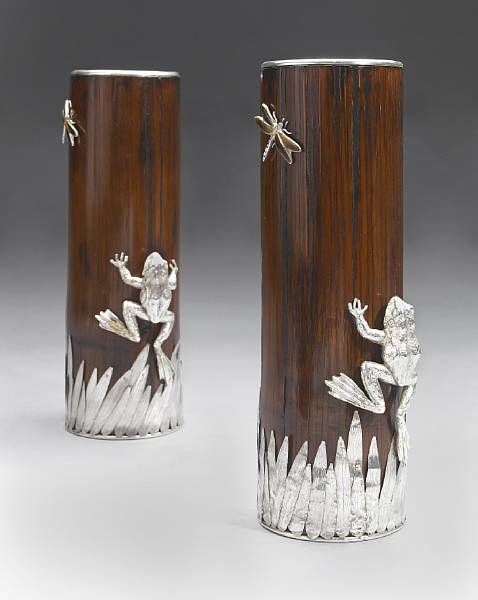 Appraisal: A pair of Japanesque style silvered metal mounted wood vases