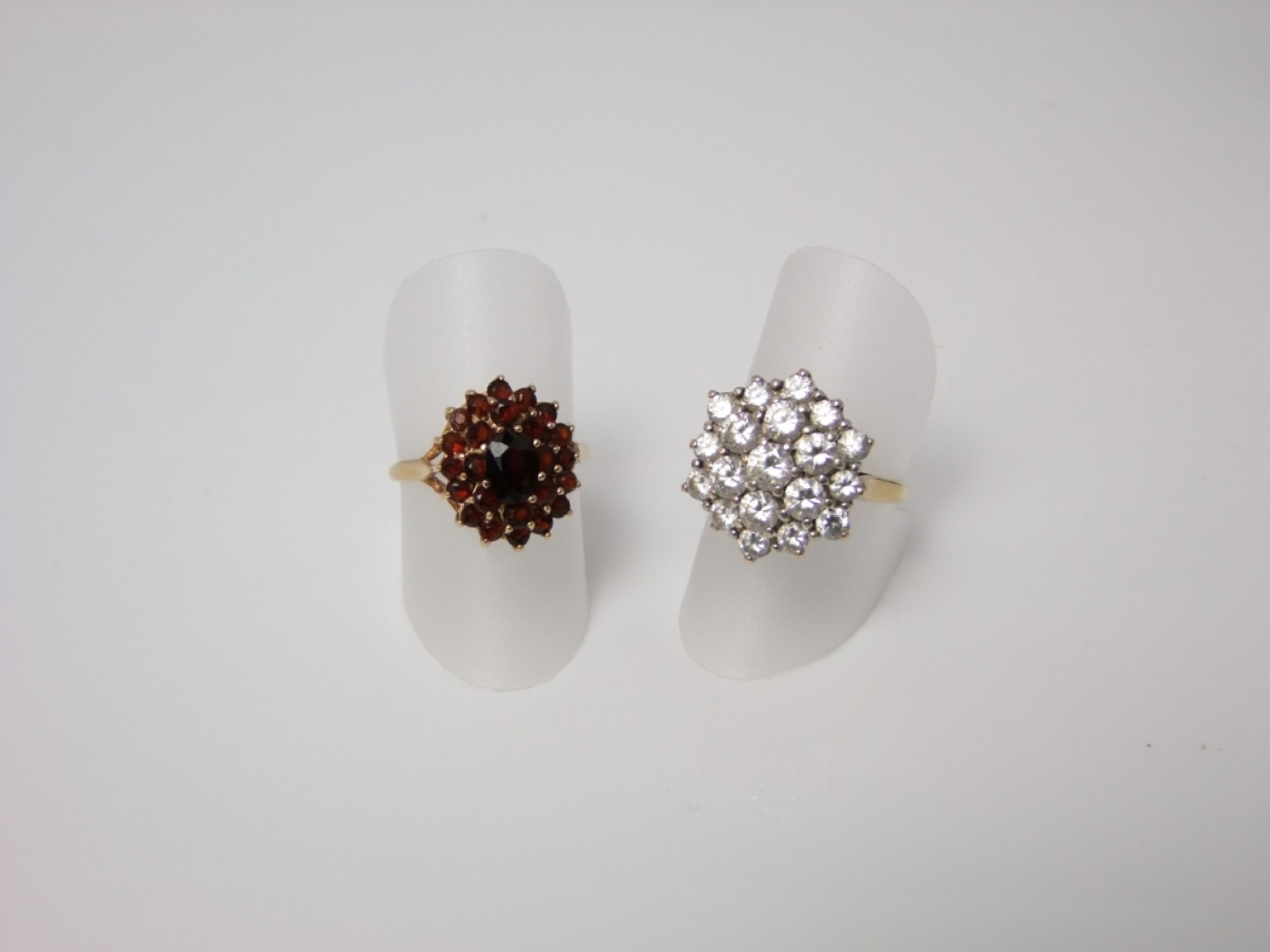 Appraisal: Two ct dress rings with garnet and white stone cluster