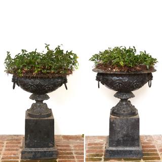 Appraisal: Pair old black painted cast iron garden urns Pair old