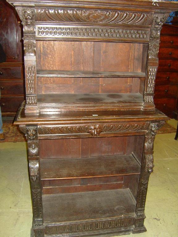 Appraisal: A Victorian carved oak -sectional free standing side cupboard with