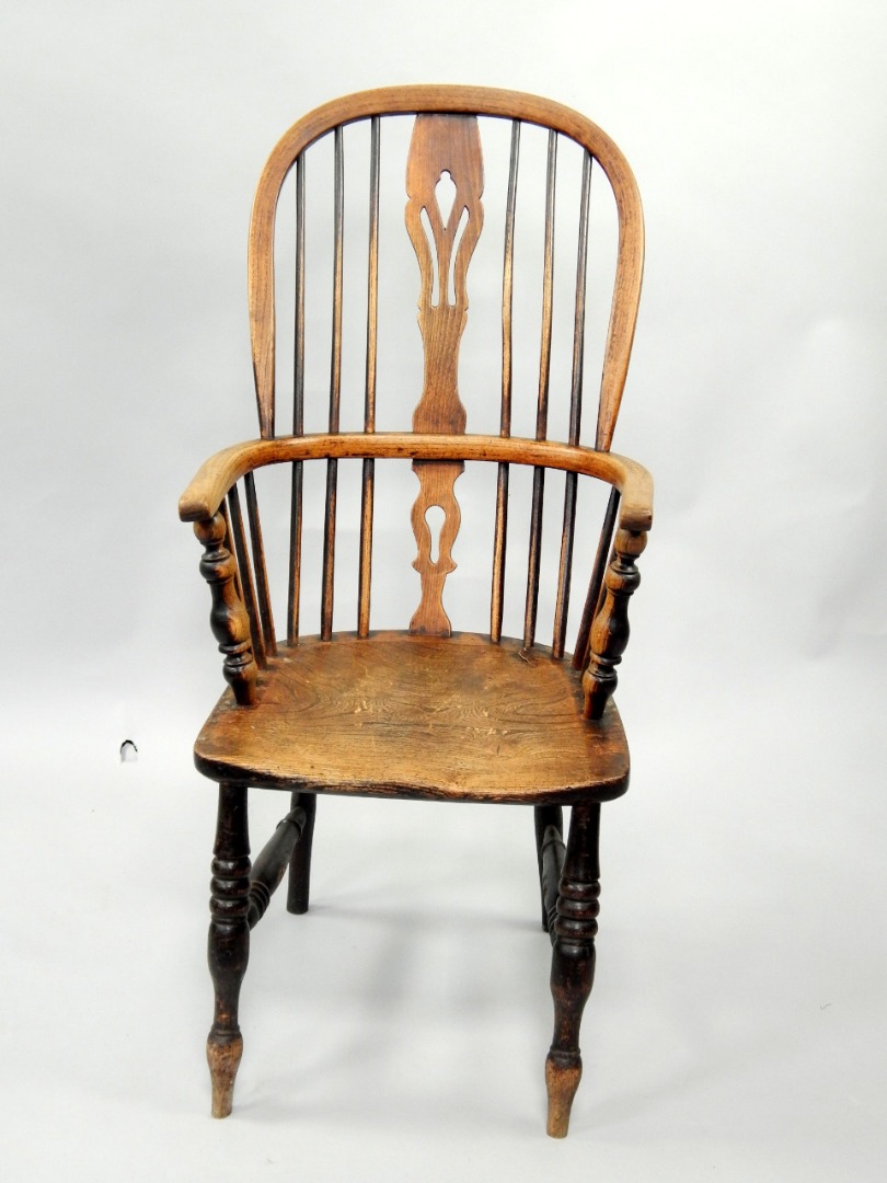 Appraisal: A thC elm and ash Windsor chair with high back