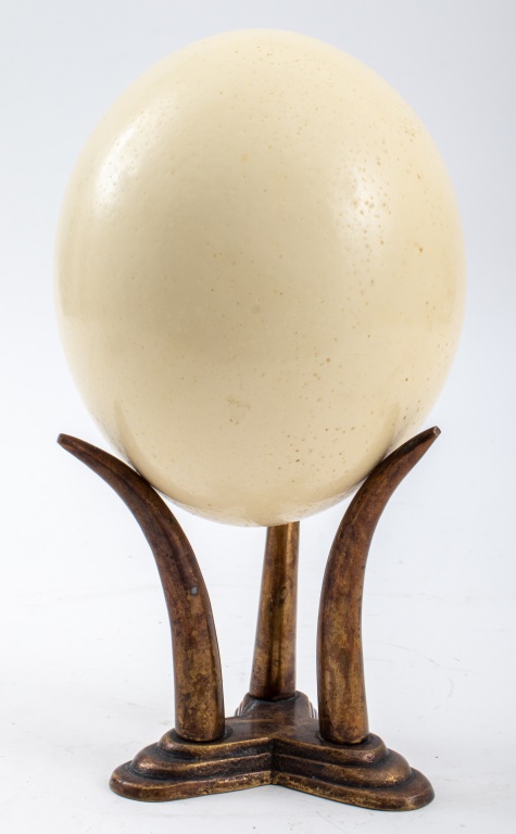 Appraisal: OSTRICH EGG ON GILT BRONZE STAND Ostrich bird egg shell