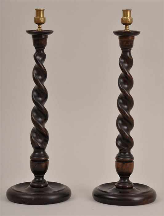 Appraisal: PAIR OF ENGLISH STAINED BEECH BARLEY-TWIST CANDLESTICKS Each with brass