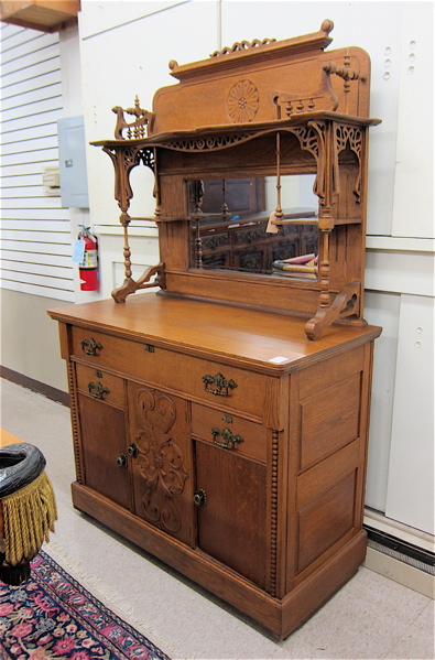 Appraisal: VICTORIAN OAK SIDEBOARD American c having a mirror panel and