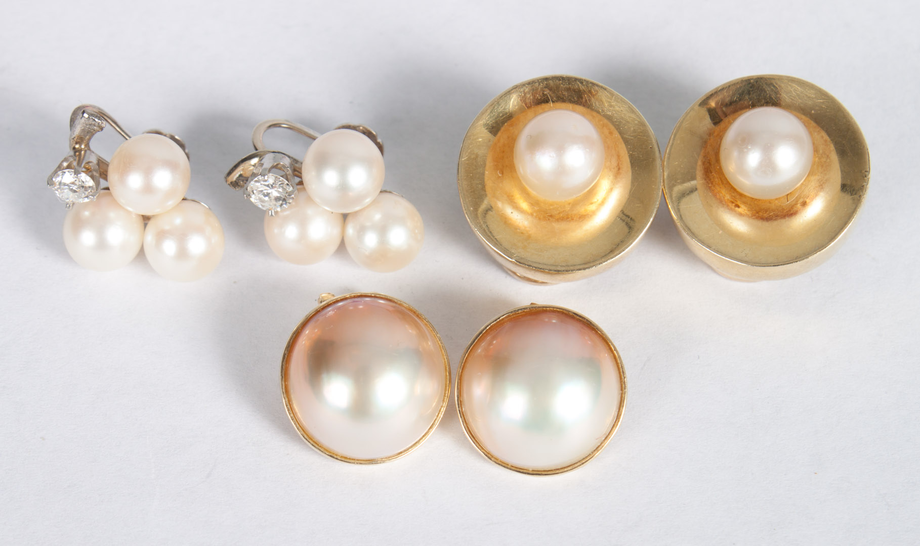 Appraisal: Three pairs of gold and pearl earrings K white gold