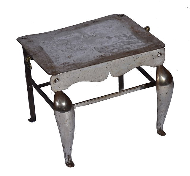 Appraisal: A GEORGIAN POLISHED STEEL FOOTMAN the rectangular top with brass