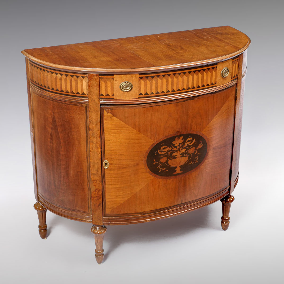 Appraisal: FRENCH STYLE INLAID DEMILUNE COMMODE Decorated with a wide band