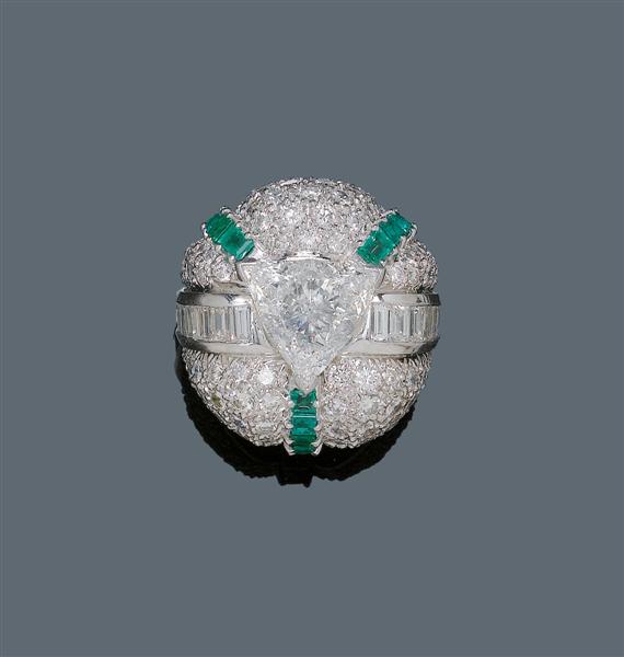 Appraisal: DIAMOND AND EMERALD RING ca Platinum Fancy ring the convex