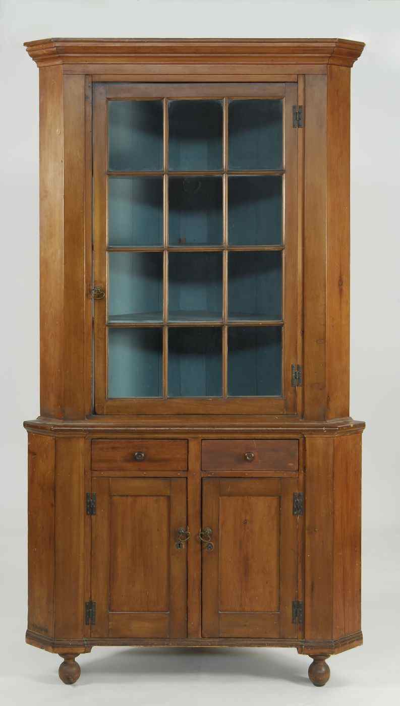 Appraisal: ANTIQUE AMERICAN TWO-PART CORNER CUPBOARD th CenturyIn pine with molded