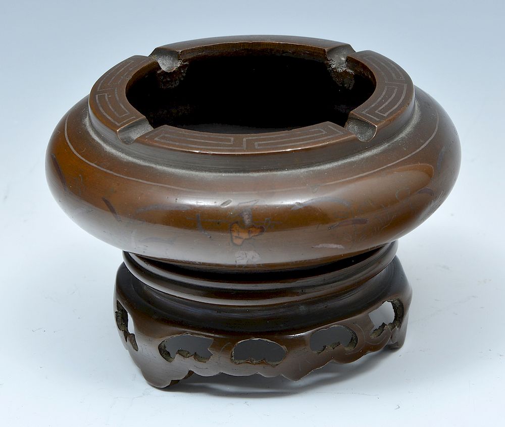 Appraisal: Chinese bronze ashtray and stand with inlay Chinese bronze ashtray