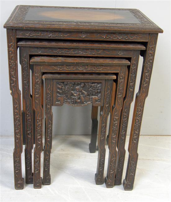 Appraisal: Nest of four Chinese hardwood tables with carved decoration of