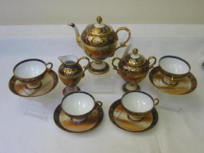 Appraisal: A NORITAKE PORCELAIN STEMMED TEA SET of four settings with