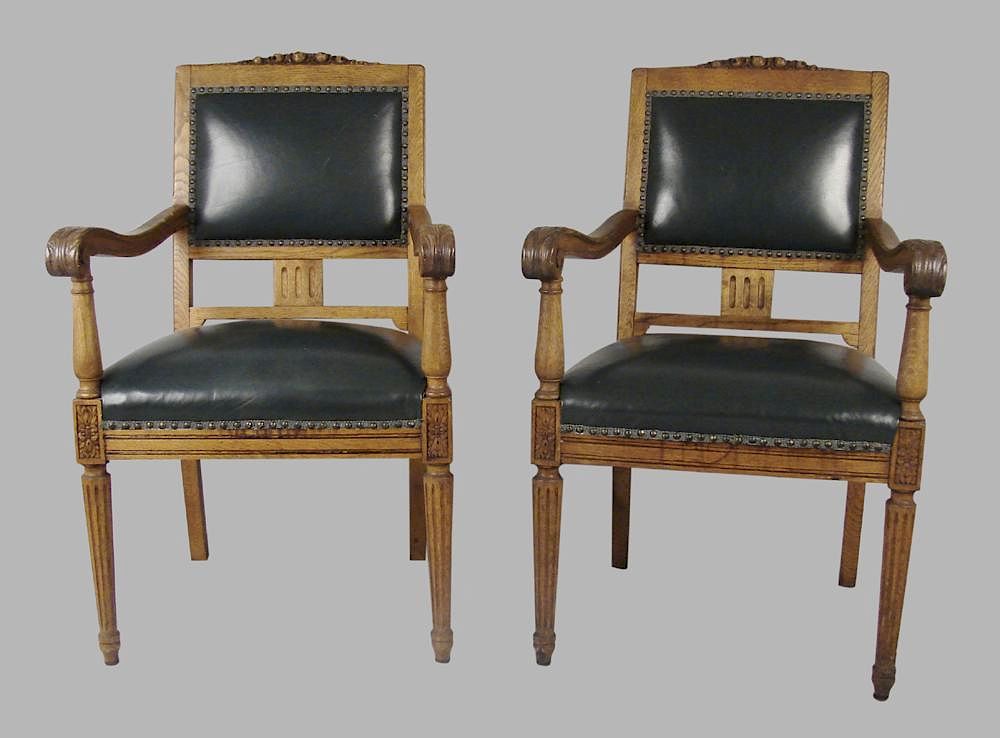 Appraisal: Pair of Large German Oak Leather Upholstered Armchairs A pair