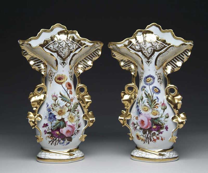 Appraisal: LARGE PAIR OF DECORATED PARIS VASES Gold trim vases have