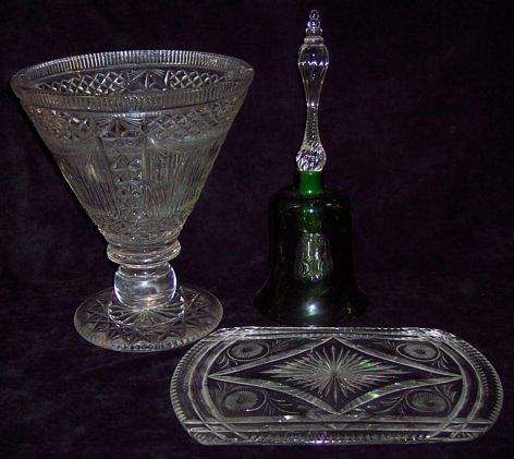 Appraisal: A green tinted glass table bell with clear glass handle