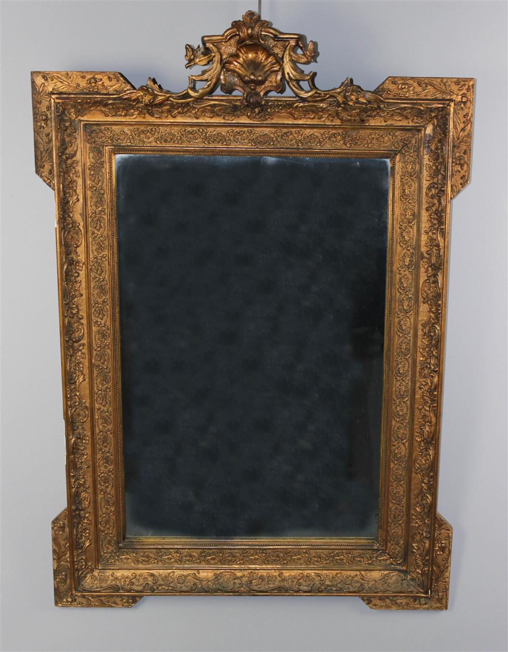 Appraisal: NEOCLASSICAL STYLE CARVED GILTWOOD MIRROR the shell carved pediment with