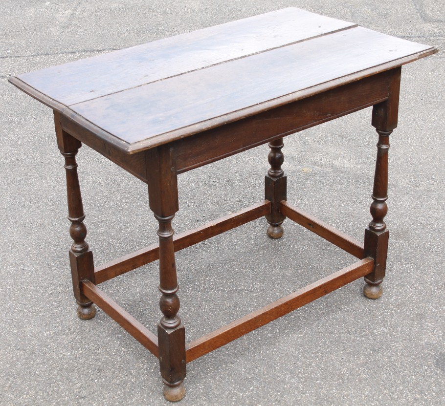 Appraisal: A Jacobean style oak side table the rectangular over hanging