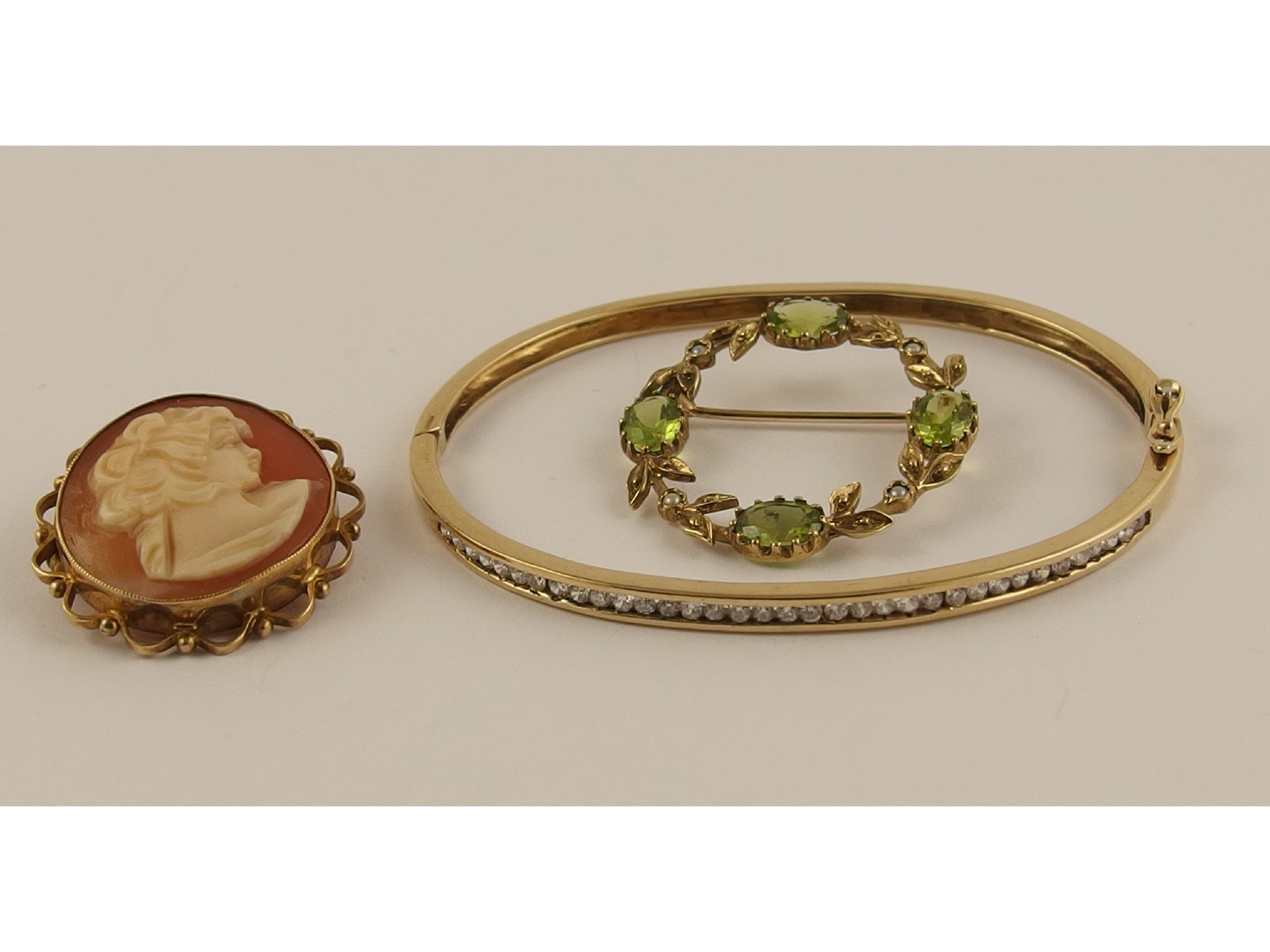 Appraisal: A ct cz set bangle a ct peridot and pearl