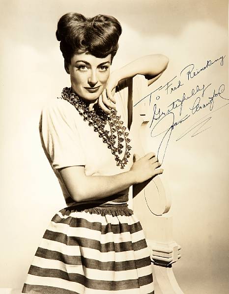 Appraisal: A Joan Crawford signed black and white photograph s A