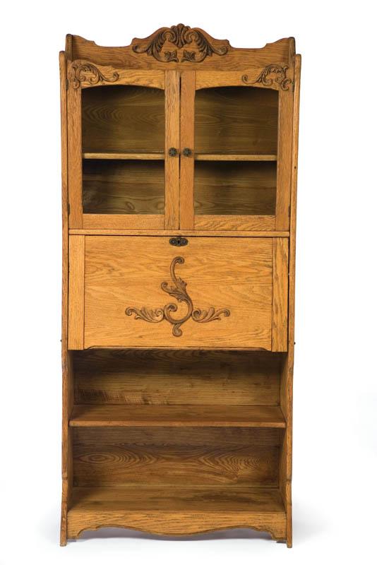 Appraisal: SECRETARY BOOKCASE Oak with a shaped top over two glazed