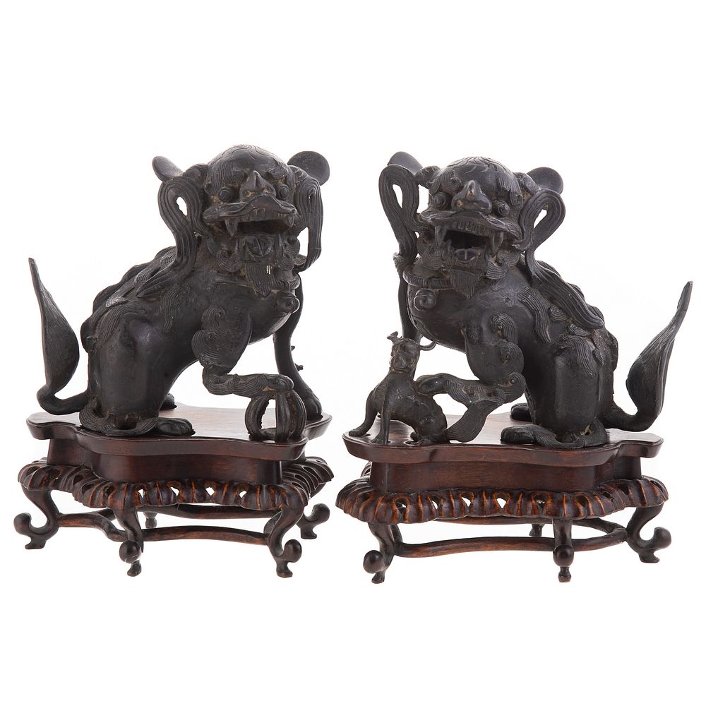 Appraisal: Pair Chinese Bronze Foo Dogs Kangxi circa seated male dog