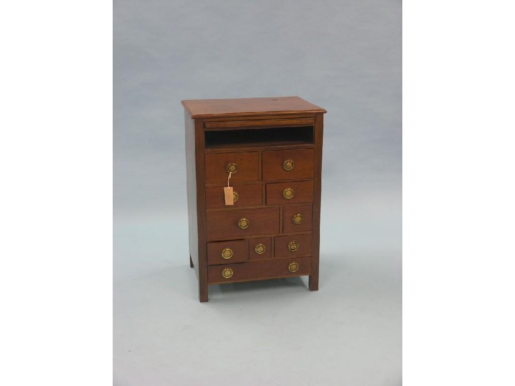 Appraisal: A mahogany cabinet of drawers brushing slide above open recess