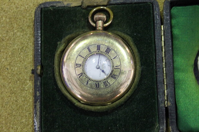 Appraisal: A LEATHER BOUND TRAVELLING WATCH CASE with plain silver mount