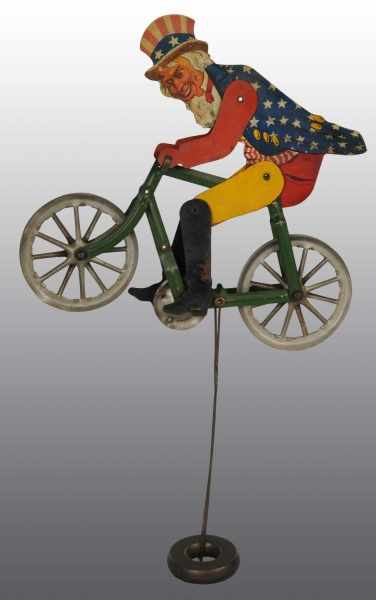 Appraisal: Uncle Sam on Bicycle Toy Description American Nice depiction of