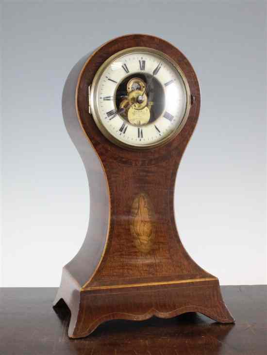 Appraisal: An Edwardian inlaid mahogany balloon case mantel timepiece with Eureka