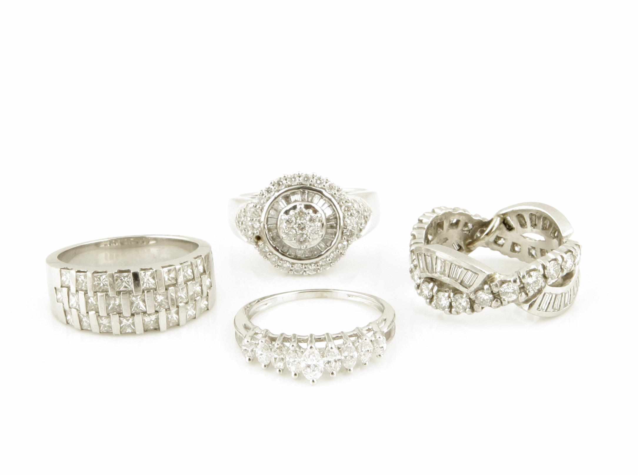 Appraisal: A collection of four diamond white gold and platinum rings