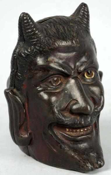 Appraisal: Cast Iron Two-Face Devil Still Bank Manufactured by A C