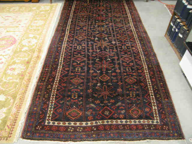 Appraisal: Kord Persian Handmade Rug overall geometric designs on indigo '