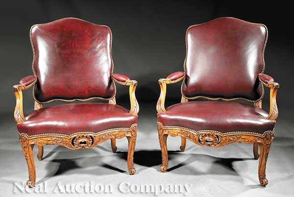 Appraisal: A Pair of Large Antique Louis XV-Style Carved Fruitwood Fauteuils