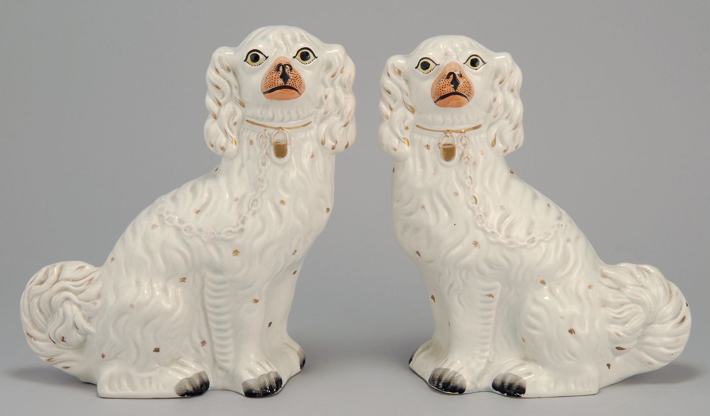 Appraisal: PAIR OF STAFFORDSHIRE POTTERY DOGS th CenturyIn white with gold