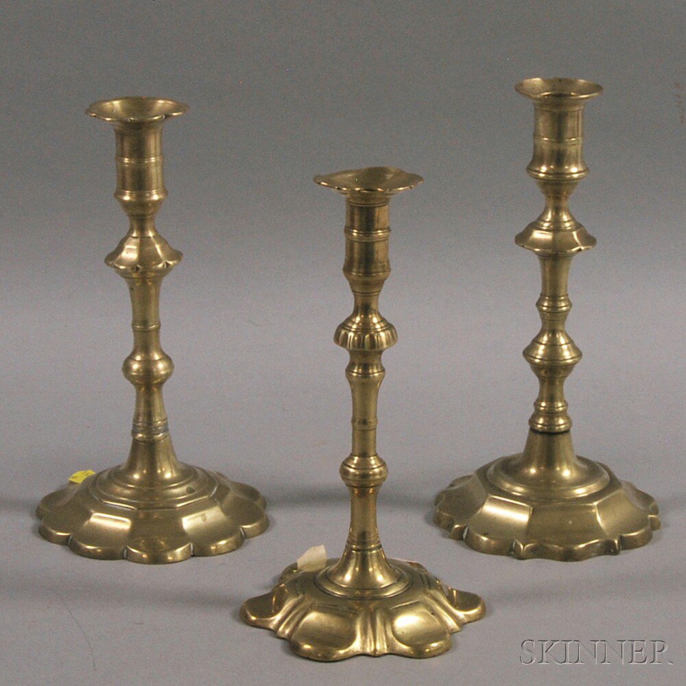 Appraisal: Three Early Brass Petal-base Candlesticks England th century ht to