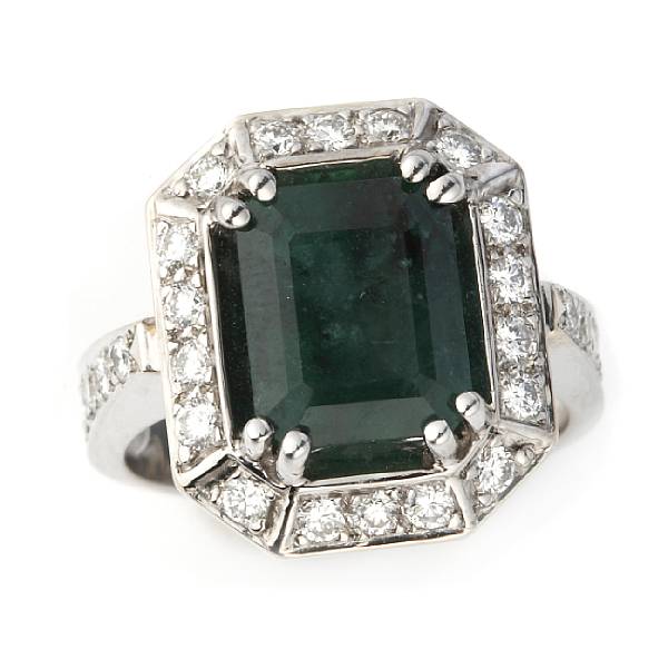 Appraisal: A rectangular-cut emerald diamond and k white gold ring