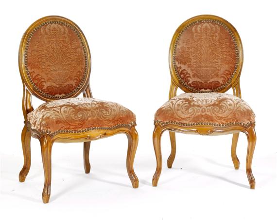 Appraisal: PAIR OF MEDAILLON-BACK CHAIRS Transition Bern th c Molded walnut