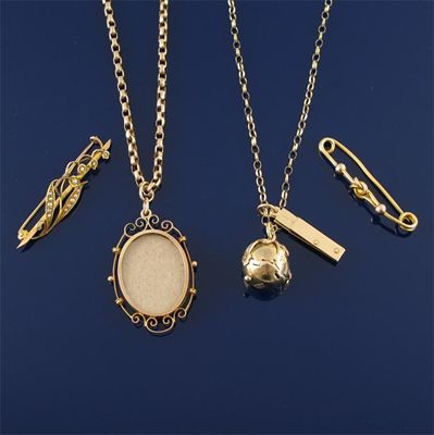 Appraisal: A gold puzzle ball pendant two gold chains a locket