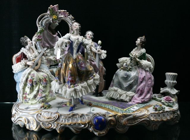 Appraisal: A th century German porcelain musician group cm wide