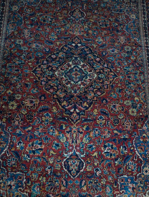 Appraisal: KASHAN RUG early th century with a red central field