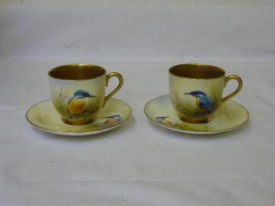 Appraisal: A PAIR OF ROYAL WORCESTER MINIATURE CUPS AND SAUCERS by