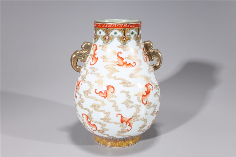 Appraisal: Chinese enameled porcelain gilt vase with molded handles and bat