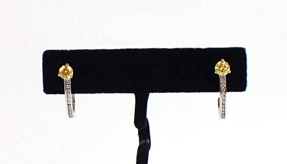 Appraisal: PAIR OF YELLOW AND WHITE DIAMOND EARRINGS including a pair