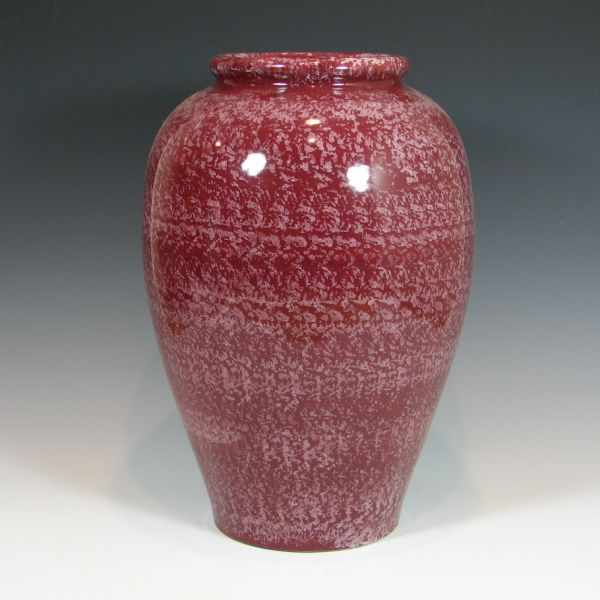 Appraisal: McCoy oil jar in speckled white on maroon Unmarked Excellent