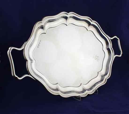 Appraisal: A 's silver two handled tea tray of shaped oval