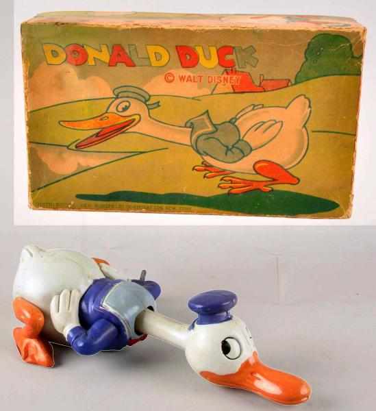 Appraisal: Celluloid Disney Crawling Donald Duck Wind-Up Toy Description Working Larger