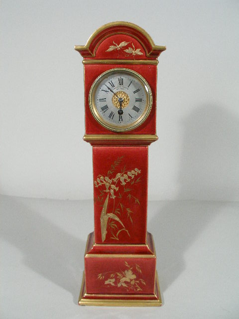 Appraisal: Camerden Forster Miniature Case Clock ca porcelain with deep red