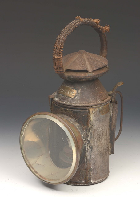 Appraisal: AN ANTIQUE GUARD'S LAMP labelled for the South Western Railway